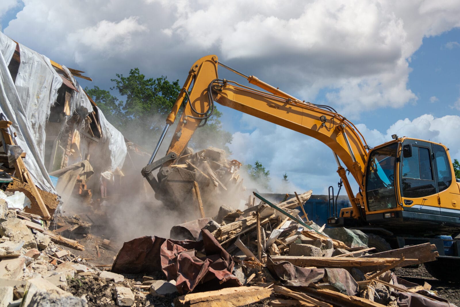 Excavator being used to demolish an old building